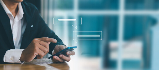 Businessman typing text message on smartphone, social media marketing technology