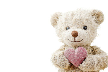 Adorable teddy bear holding heart isolated on transparent PNG