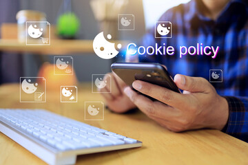 cookie policy concept with user holding smartphone to reading policy or terms and condition before...