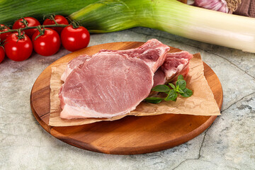 Raw pork steak loin with bone