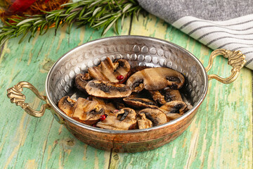 Tasty hot grilled champignon mushrooms