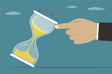 Deadline, hourglass. Patience time. Project deadline, running out time management. Businessman hand trying to stop hourglass or sandglass before it fall.