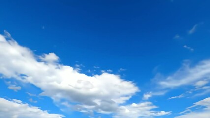 Vivid blue sky with beautiful white cumulus clouds floating past in a smooth animated timelapse view - Powered by Adobe