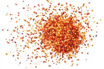 Scattered red chili flakes on white background