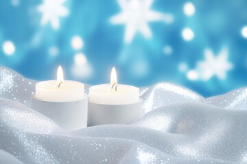 Two white candles on shimmering fabric, glowing softly against a blue bokeh background