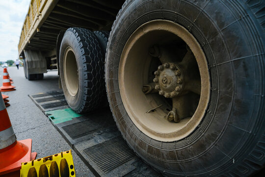 Close-up of a truck on an electronic scale for weighing trucks