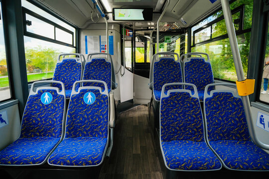 Empty bus interior. Seats without passengers. Public transport.