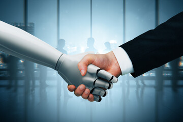 Human and robot handshake symbolizing AI partnership and technological collaboration in a futuristic business environment background.
