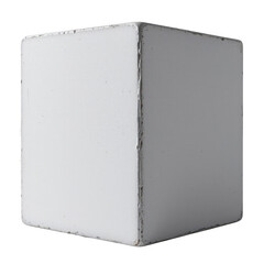 a cube with a faded surface dominates the frame against a plain dark background. the surface is mostly white and the paint coating shows signs of wear, with some chipping and discoloration