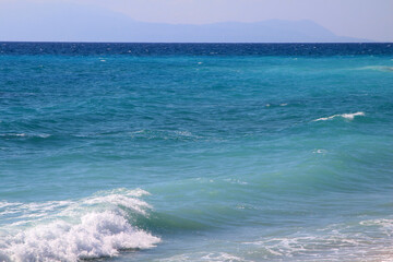 Turquoise sea water background in summer (Monolithi beach, Greece)