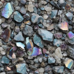 Colorful mineral stones and crystals scattered on a surface, sparkling under light.