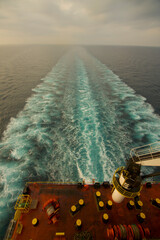 View of the stern of a merchant ship at sea in the morning