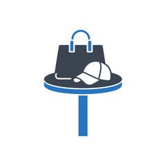 Bag and Hat on Table Icon