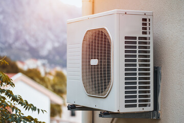 Wall-mounted air conditioner for residential cooling and heating