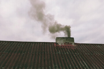 Polluted air with black chimney exhaust