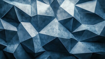 Fototapeta premium Abstract geometric shapes on textured blue surface in studio