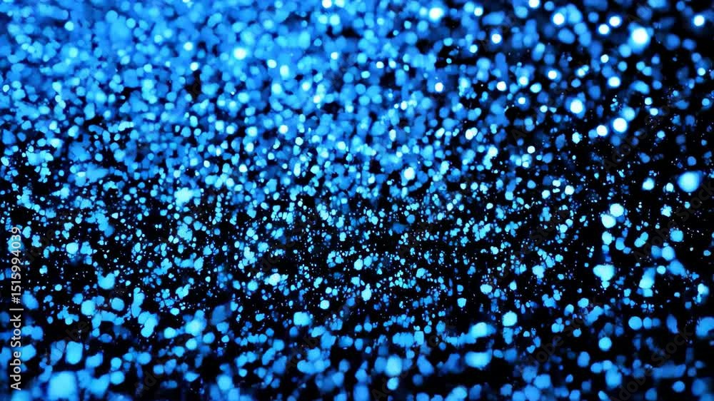 Poster abstract shimmering dots of blue light cascade down against a stark black background creating a mesm