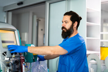 Medical professional operating advanced dialysis machine in hospital setting