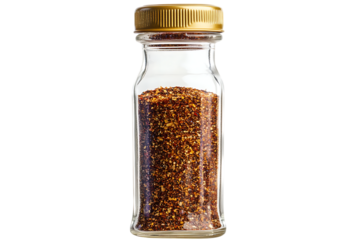 Dried chili flakes in clear glass bottle with gold lid on trasparent background