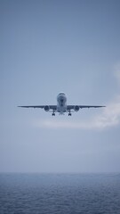 Airplane in the sky, over the cloudy sky
