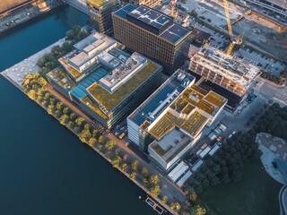 Aerial view of urban architecture with green rooftops.