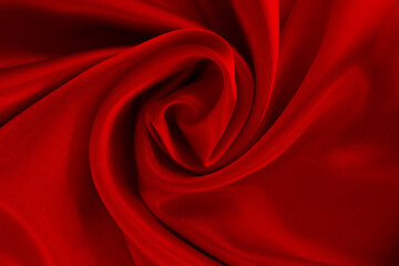 Dark red fabric texture background, detail of silk or linen pattern.