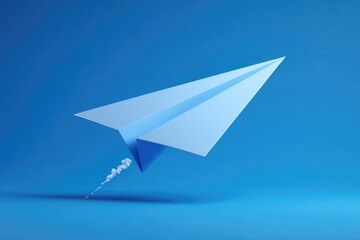 Light blue paper airplane in flight against a vivid blue background.