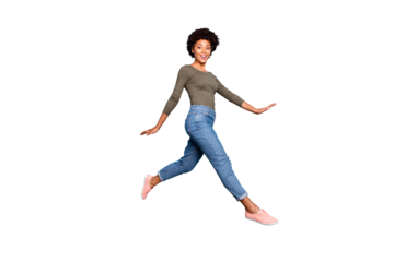 Full body photo of dark skin pretty lady jumping high walking down spring foreign street charming motion wear casual outfit isolated pastel blue color background