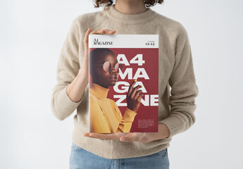 Mockup Of Woman Holding Customizable A4 Magazine