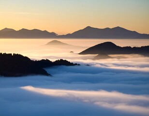 Obraz premium Sunrise over misty mountains (1)
