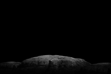 Stone podium on dark black background..