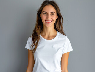 Fototapeta premium Happy young woman with cute smile wearing white t-shirt indoor portrait