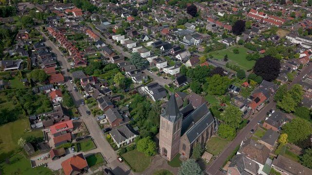 Aerial view of Zeddam, Municipality of Montferland, The Netherlands. Sint Oswald Church and residential neighbourhood from above