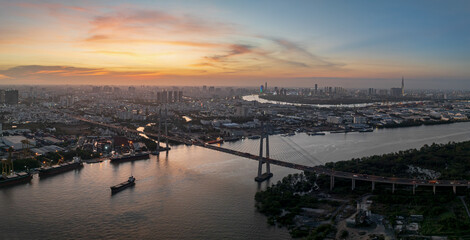 Stunning view of Phu My bridge in Ho Chi Minh City at sunset overlooking the river and skyline