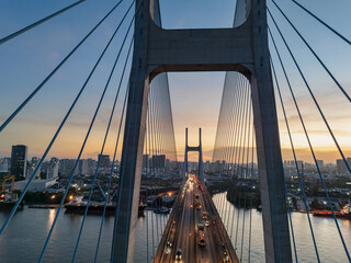 Phu My bridge in Ho Chi Minh City provides stunning views of urban life and river traffic during sunset
