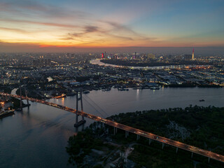 Phu My bridge illuminated at dusk over the Saigon River in Ho Chi Minh City, Vietnam