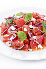 Fresh Watermelon Feta Salad with Mint and Red Onion isolated on white background. Close up