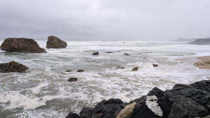 stormy panoramic rough sea in cloudy autumnal winter weather and ocean water waves and foam