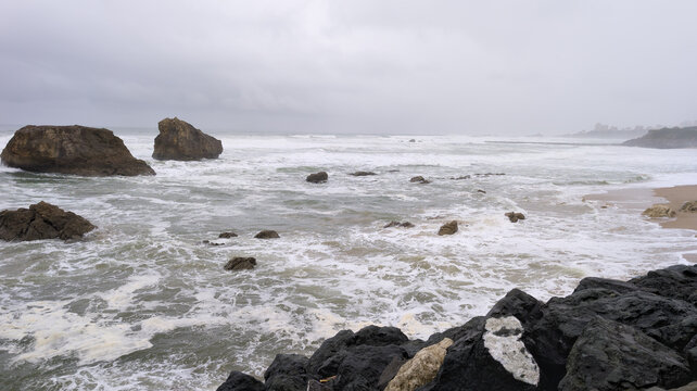 Fototapeta stormy panoramic rough sea in cloudy autumnal winter weather and ocean water waves and foam