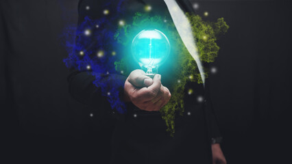 Creative concept of innovation and bright ideas. A hand holding a glowing light bulb with colorful smoke on dark background, symbolizing imagination, inspiration, and creativity.