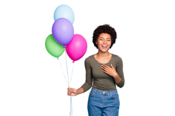 Portrait of positive cheerful mulatto girl hold baloons got for anniversary have free time with friends listen funny jokes laugh wear green stylish jumper denim jeans isolated blue color background