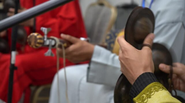   Hands Playing Traditional Gnawa Qraqeb and Guembri in Ceremony &ndash; Morocco
