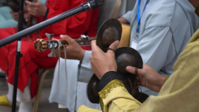   Hands Playing Traditional Gnawa Qraqeb and Guembri in Ceremony &ndash; Morocco
