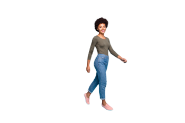 Full length body size photo of cheerful cute charming nice black woman going turned walking smiling friendly toothily isolated over vivid color blue background