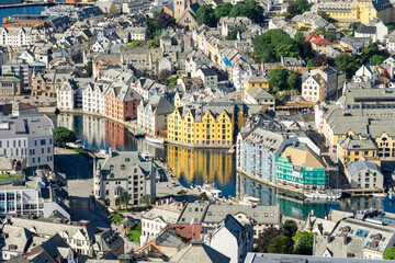 High angle view of downtown of Alesund on the west coast of Norway, with its colorful Art Nouveau buildings along the brosundet Canal in a sunny day