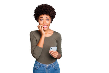 Omg blog troubles. Portrait of negative afraid mulatto girl feel nervous bite nails use cellphone...