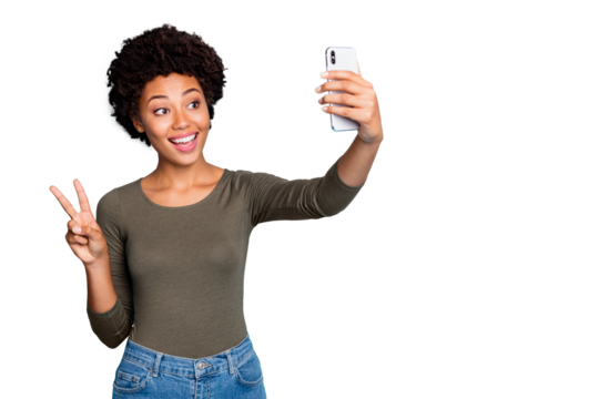 Copyspace photo of cute nice charming fascinating black woman kind friendly showing v-sign to those she speaks with video call wearing jeans denim greed sweater isolated vivid blue color background