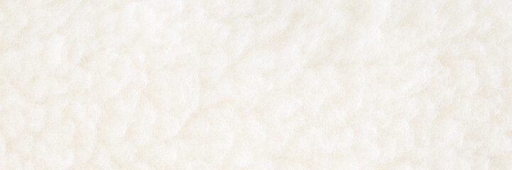 Clean white soft natural sheep wool background. Wide banner. Closeup. Top down view.