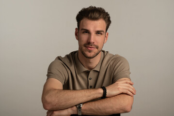 Portrait of young man on gray background