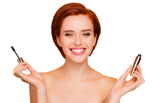 Close-up portrait of nice dreamy lovely sweet attractive winsome cheerful positive girl holding in hands showing black mascara clear flawless skin isolated over beige pastel background